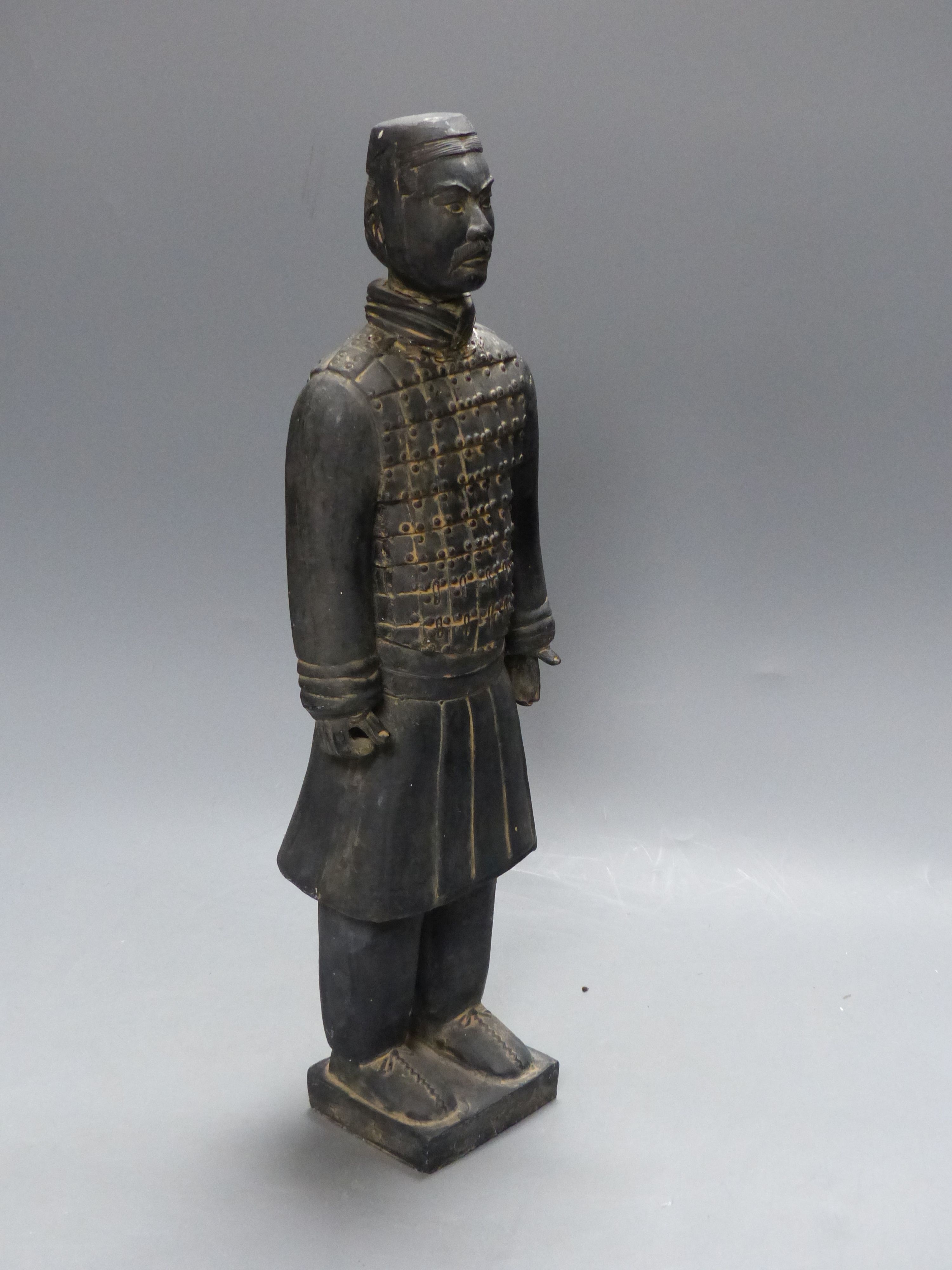 A Chinese grey pottery figure in Han style, height 47cm